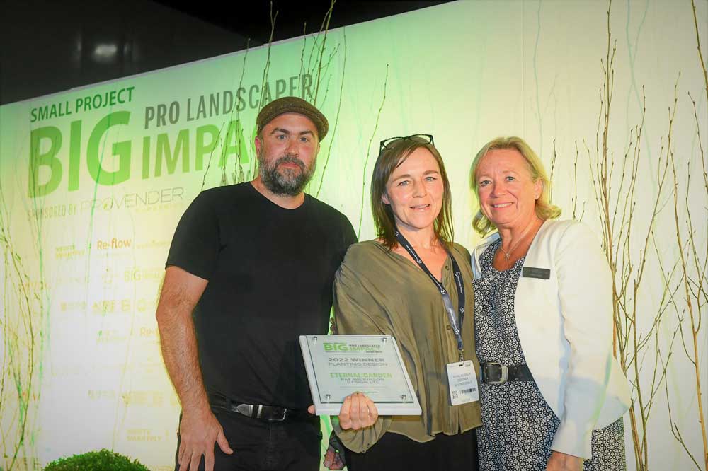 Rae WIlkinson receiving the award for best planting design under £25,000