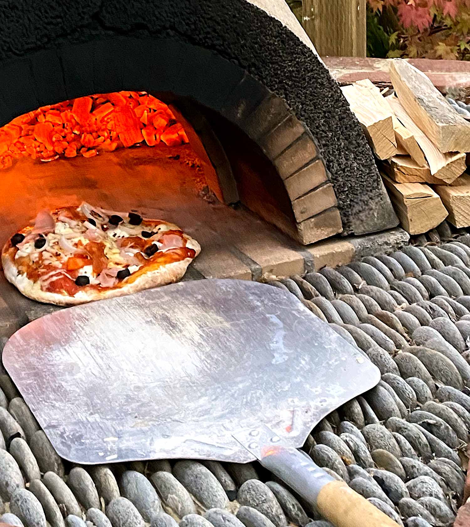 Pizza oven in use - barn courtyard garden