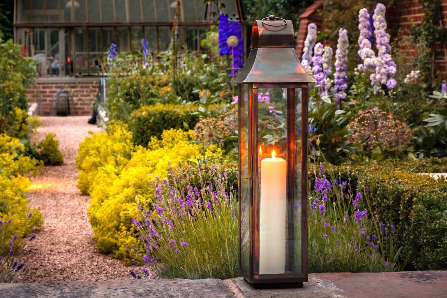 Garden lamp on a wall. Rae Wilkinson Garden and Landscape Design Surrey, Sussex, Hampshire, London, South-East England