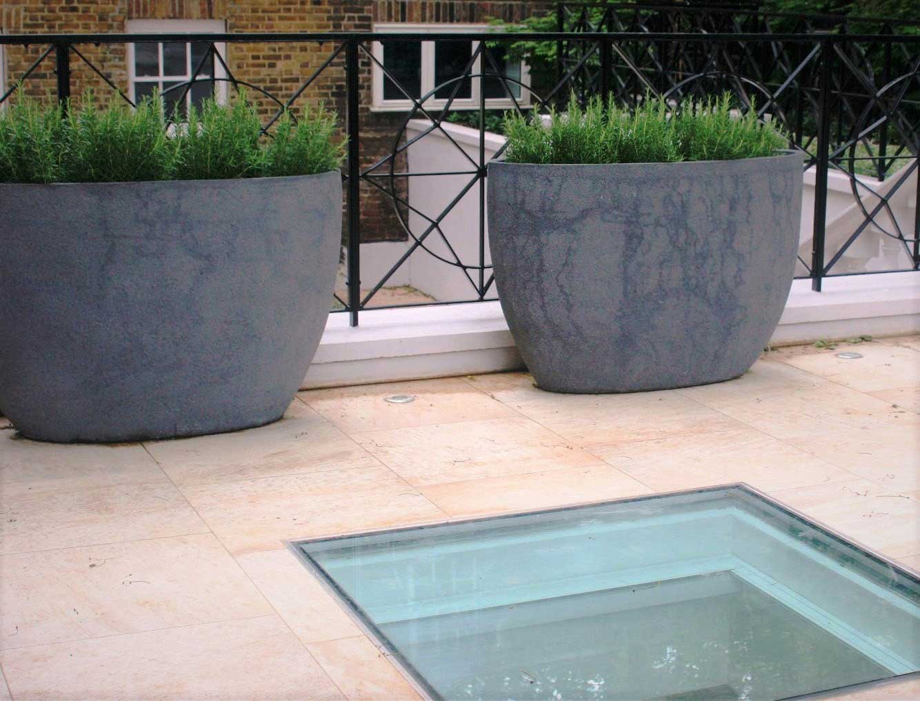 City Retreat Garden London. Upper terrace with concrete planters. Rae Wilkinson Garden and Landscape Design Surrey, Sussex, Hampshire, London, South-East England